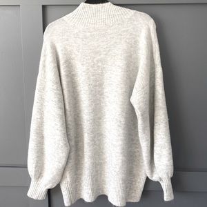 Warm dress with oversized (bouffant) sleeves